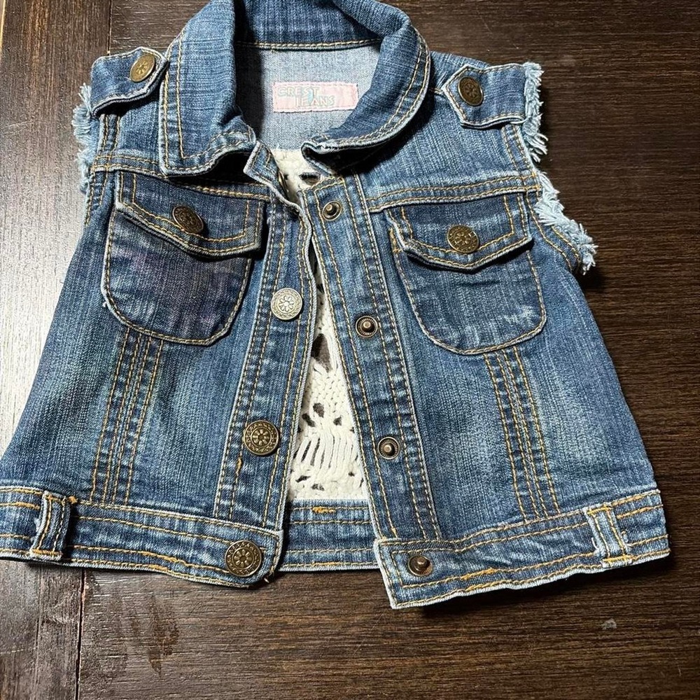 blue denim vest with frayed hem